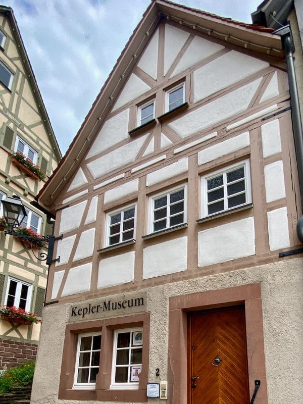 Weil der Stadt - Kepler Museum - a narrow museum with a light brown plinth, otherwise whitewashed brickwork and light brown half-timbering - angiestravelroutes.com