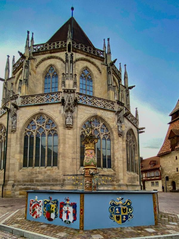 11-swabian-gmuend-saint-cross-muenster-loewenbrunnen Lion fountain in front of the Holy Cross Minster in Schwäbisch Gmünd