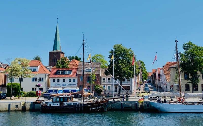 Neustadt harbor with sailing boats and church tower - angiestravelroutes.com