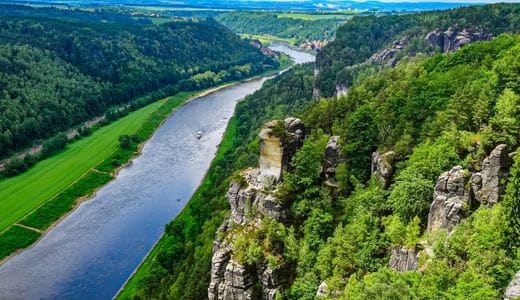 Saxon Switzerland, Saxony - the Elbe river with striking rock formations on the right, photographed from a viewpoint - angiestravelroutes.com