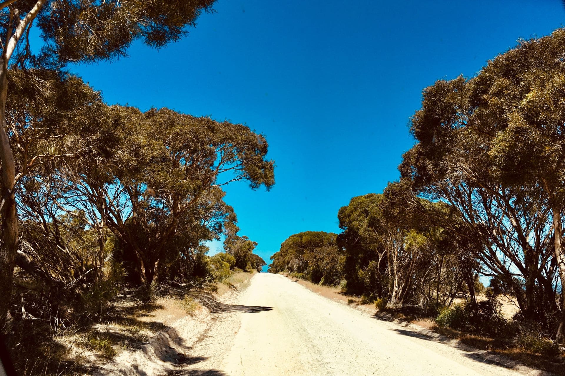 Featured photo - How to Plan a Road Trip in 3 steps - unpaved road on Kangaroo Island, Australia - angiestravelroutes.com