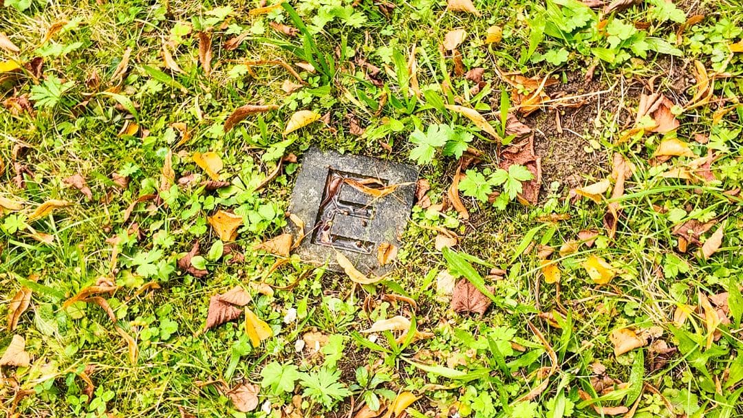 Grafeneck Memorial, a stone (letter E) embedded in the lawn - angiestravelroutes.com