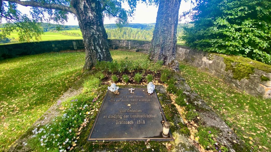 Grafeneck Memorial - bronze memorial plaque in the cemetery, inscription "I know/The Lord will do right by the wretched/and the poor (Psalm 140:13). In memory/of the victims of inhumanity/Grafeneck 1940