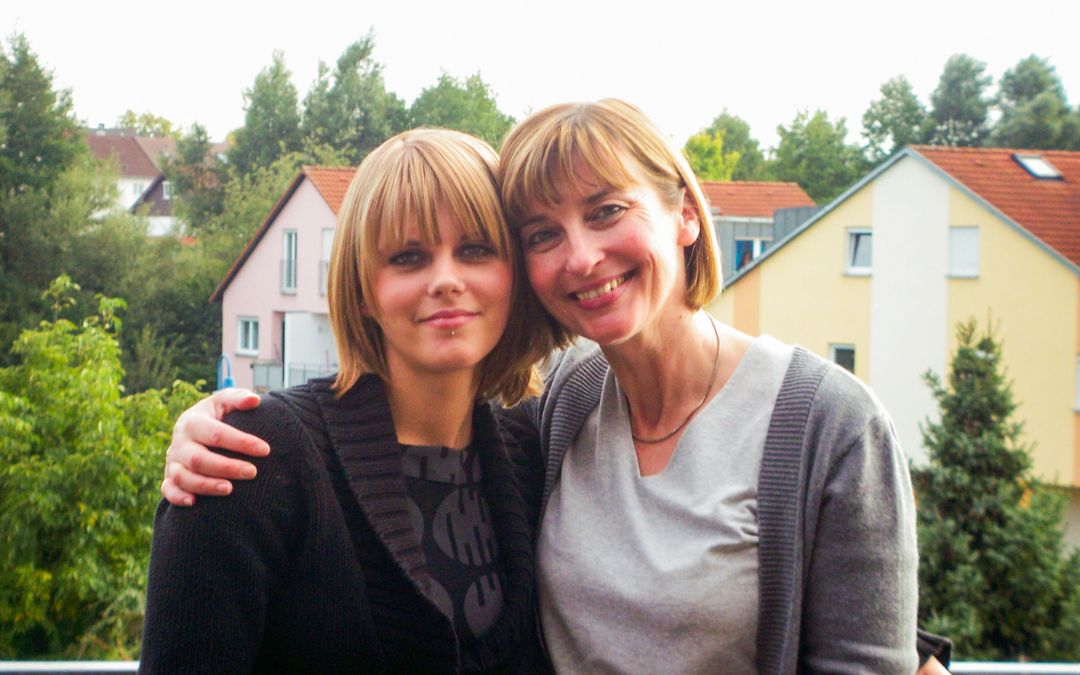 Herrenberg ca. 2006 - Anna and I on the balcony of the Herrenberg apartment, in the background some houses, I put my arm around Anna's shoulder - angiestravelroutes.com