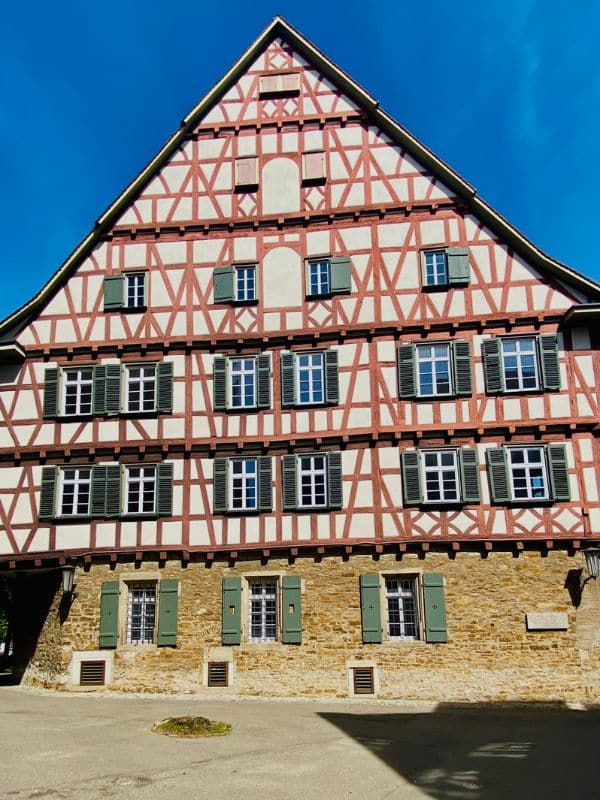 Deanery building - magnificent half-timbered building from the 17th century with green shutters - angiestravelroutes.com