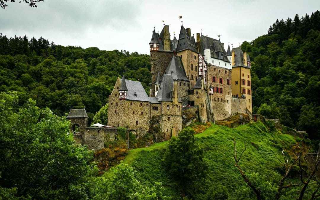 Eltz Castle in a wooded valley on the side of the Moselle River
