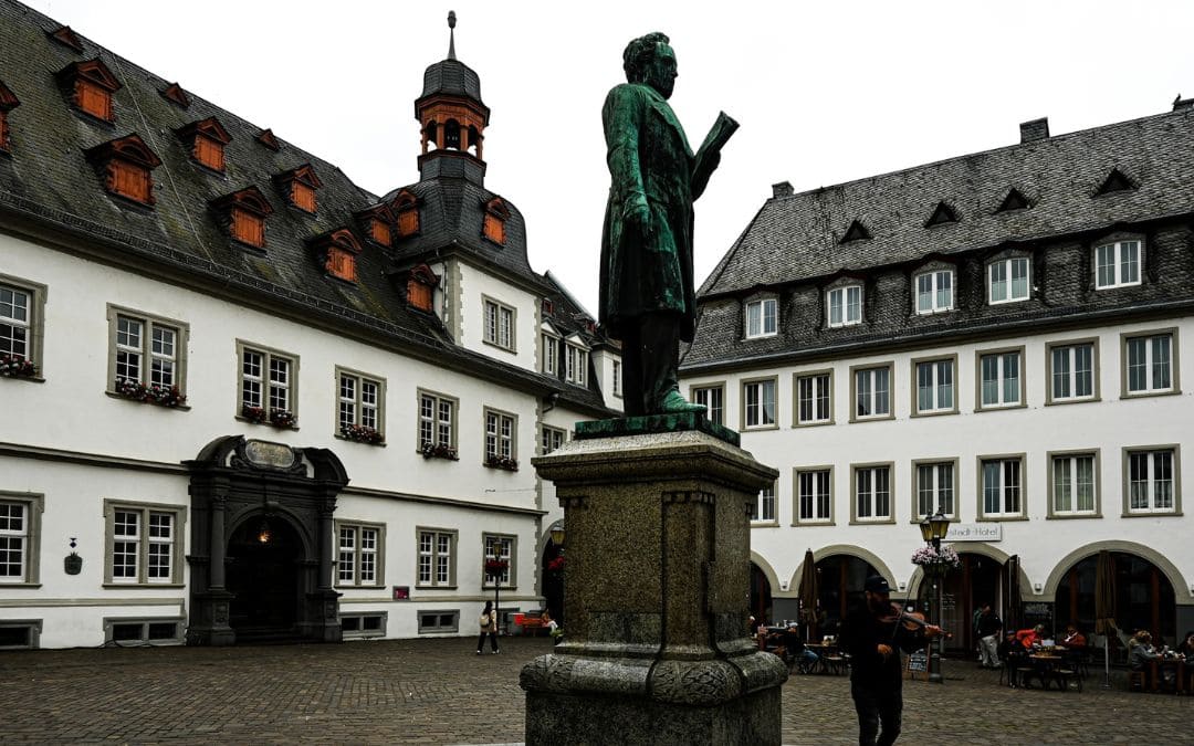 Jesuitenplatz, featuring the Johannes Müller Monument and historic buildings in Koblenz