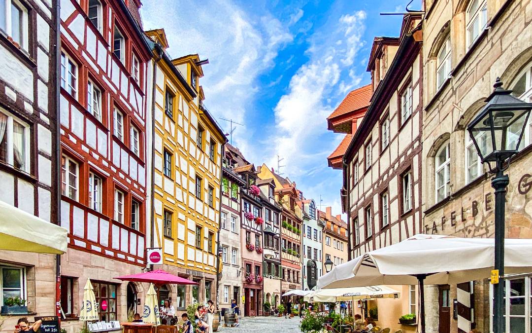 Weißgerbergasse, Nuremberg - View into the alley with many colorful half-timbered houses - angiestravelroutes.com