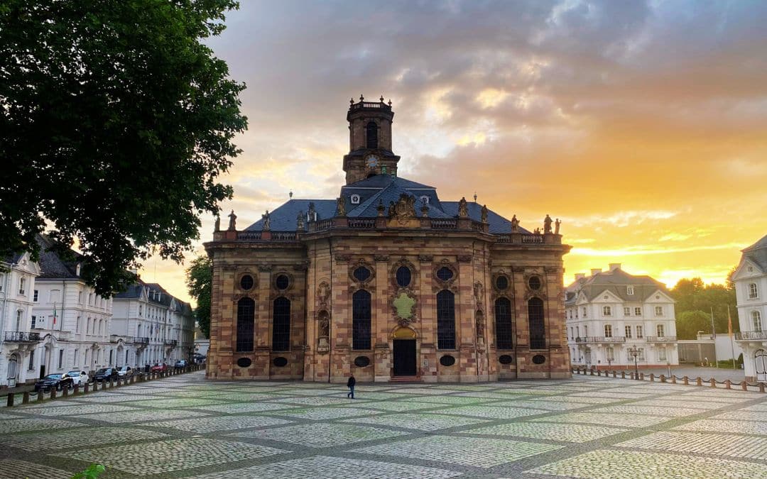 Ludwigskirche in Saarbrücken against the backdrop of an orange sunset