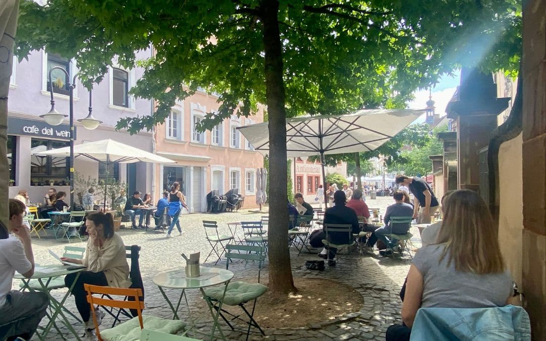 Café LUUC: An outdoor café under shady trees in Saarbrücken's Old Town