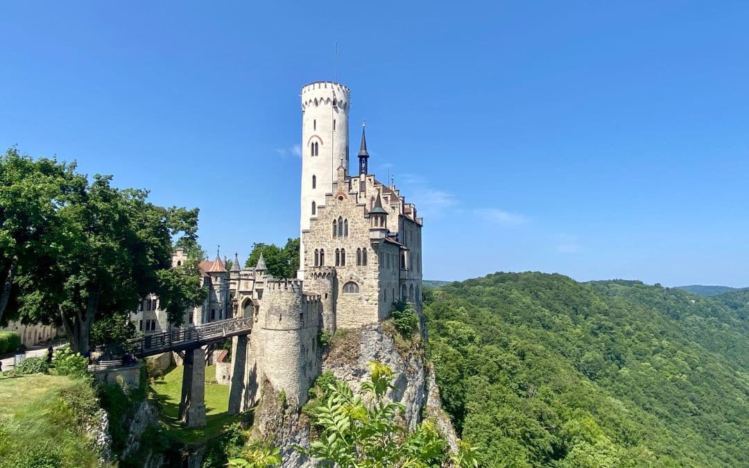 Lichtenstein Castle, Swabian Alb: the castle with its striking white tower is enthroned on a rock in the middle of the wooded hills of the Swabian Alb - angiestravelroutes.com