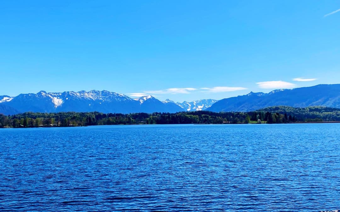 View from the passenger ship across the Staffelsee to the Alps: blue lake, blue mountains, blue sky