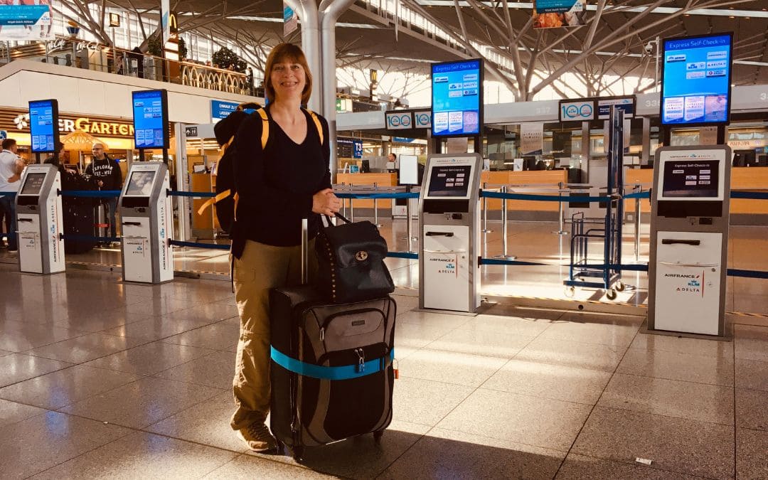 With a large suitcase and two rucksacks at Stuttgart Airport - angiestravelroutes.com