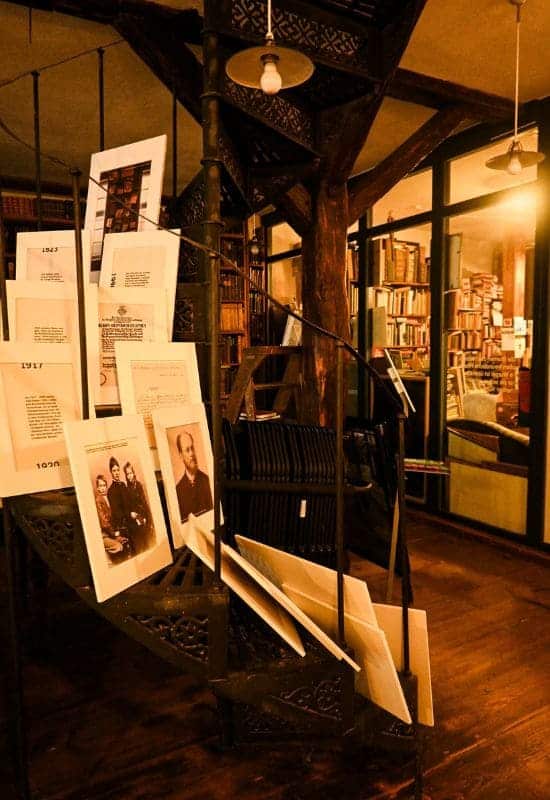 Hesse Cabinet, Tübingen: Old bookshelves and spiral staircase with photos from Hermann Hesse's life