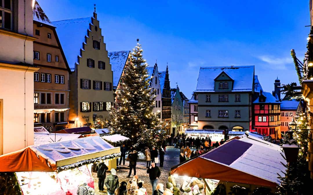 Rothenburg ob der Tauber Christmas Market - Marketplace with illuminated Christmas tree and decorated market stalls - angiestravelroutes.com