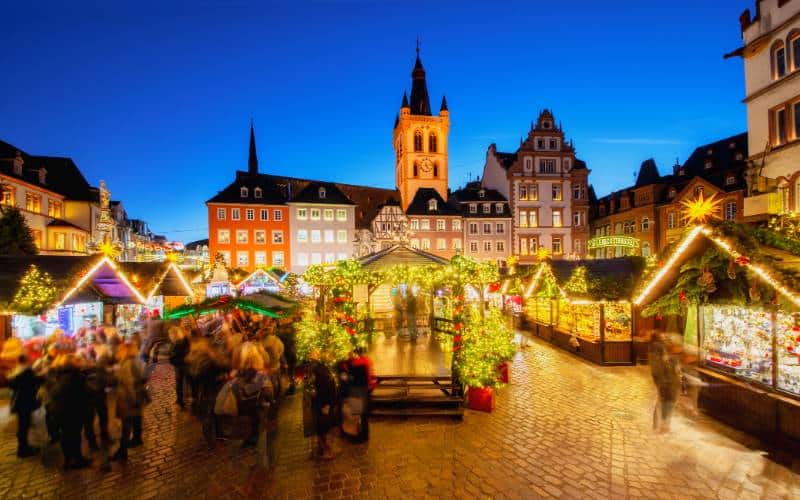 Christmas market Trier in the late afternoon - Main market with festively decorated stalls - angiestravelroutes.com
