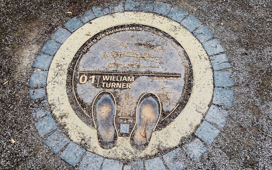 Bronze plaque #01 from the William Turner Route featuring a stylized depiction of Ehrenbreitstein Fortress.